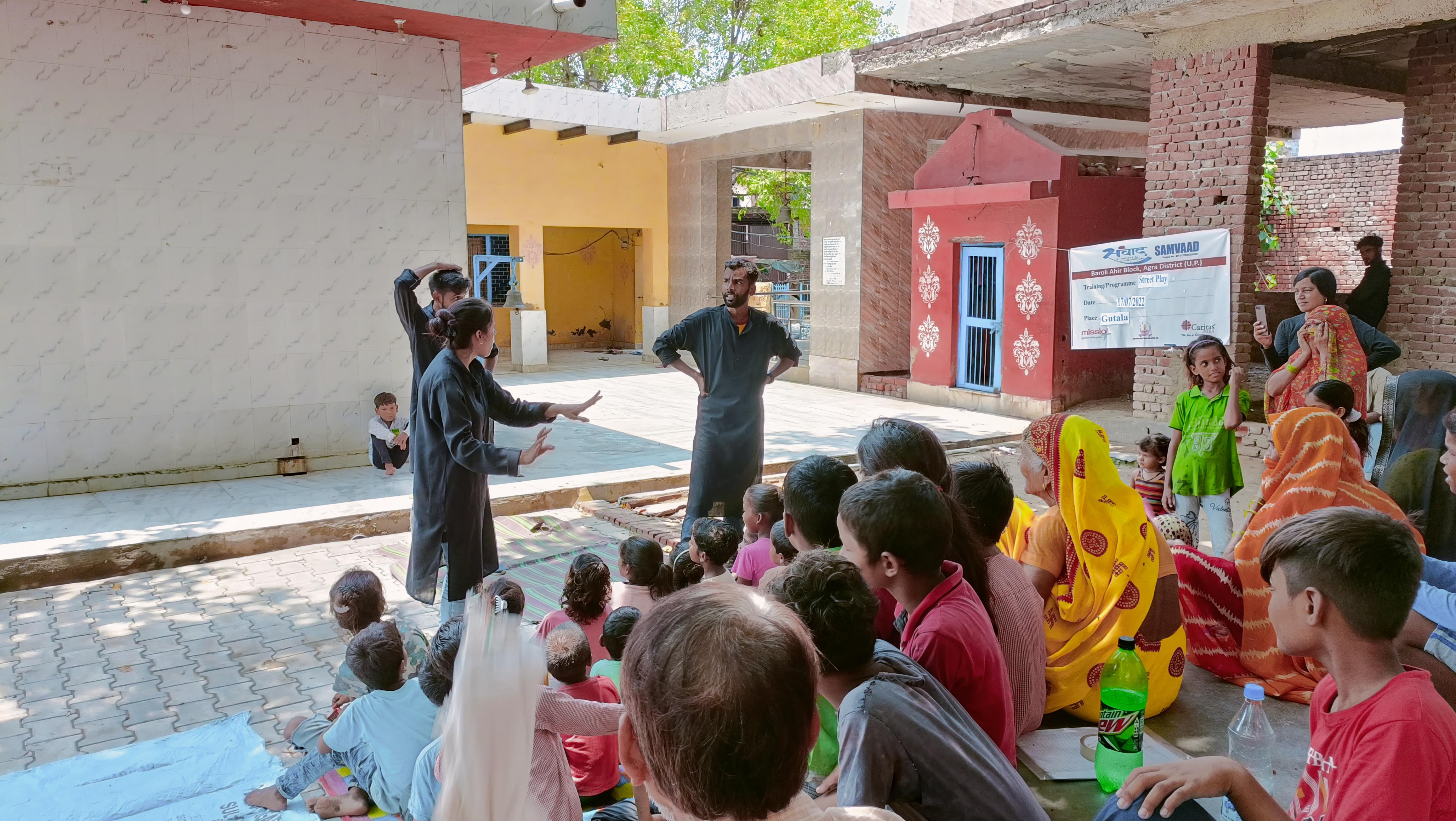 Community members in discussion — replace with local photo